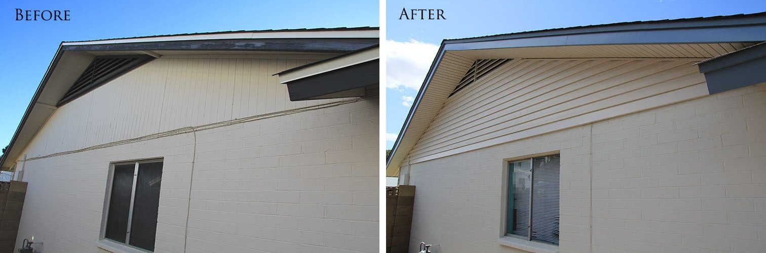 Gable with painted siding over a block wall before; new vinyl siding and soffit with blue-grey fascia after