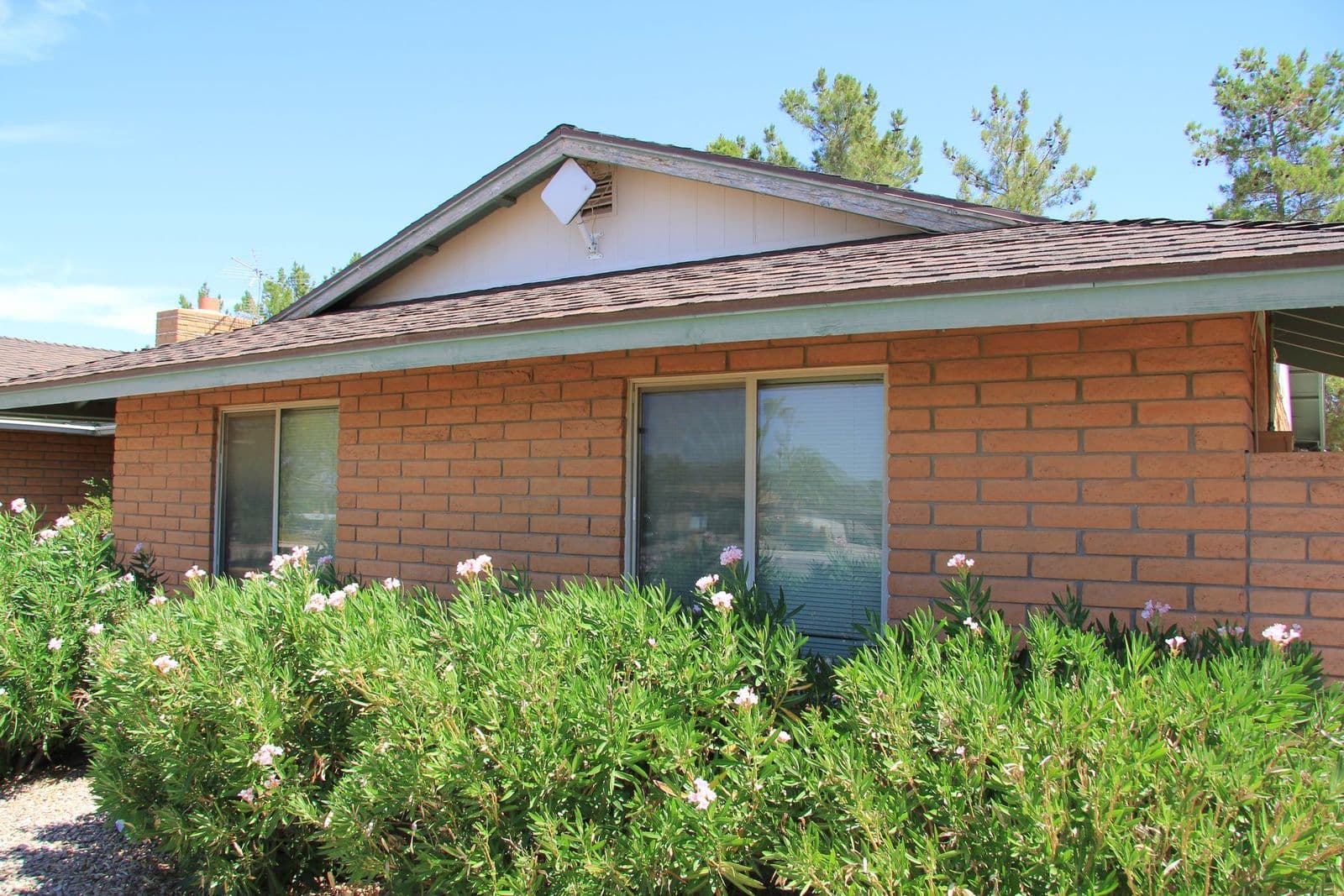 Brick home with a sided gable and new trim