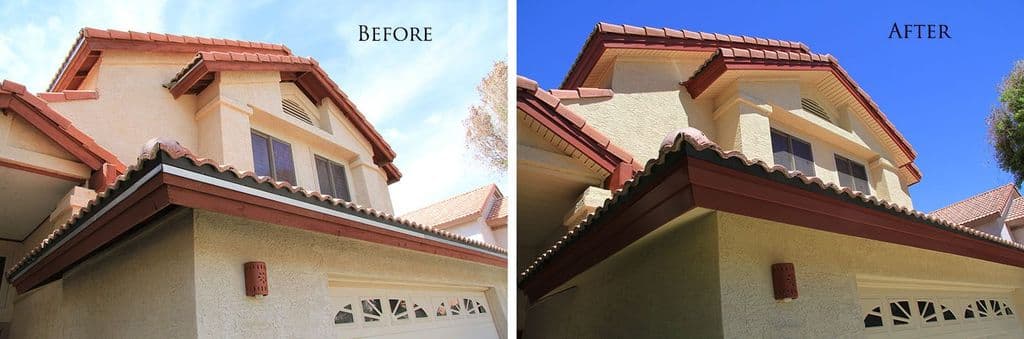 Two-storey tan stucco house with red tile roof: worn red-painted wood fascia and open eaves before; dark red wrapped fascia and almond vinyl soffit after